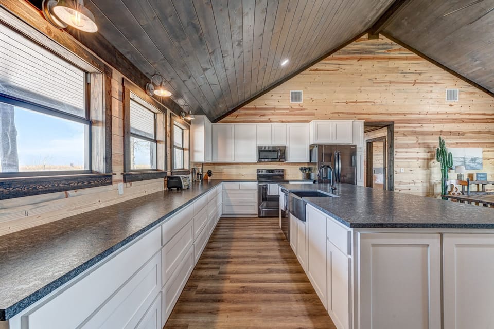 View looking left from the entry door down the length of the kitchen.
