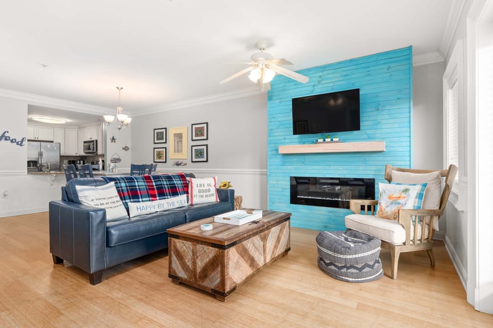 Living area with TV and access to balcony