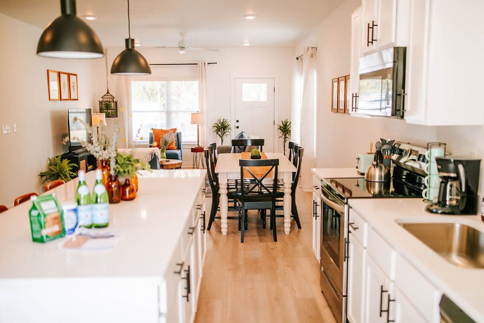 We love this open layout! It’s the perfect spot to keep the conversation going while you’re prepping a meal or grabbing a snack. We hope it makes your group’s stay in The Classic City even more comfortable.