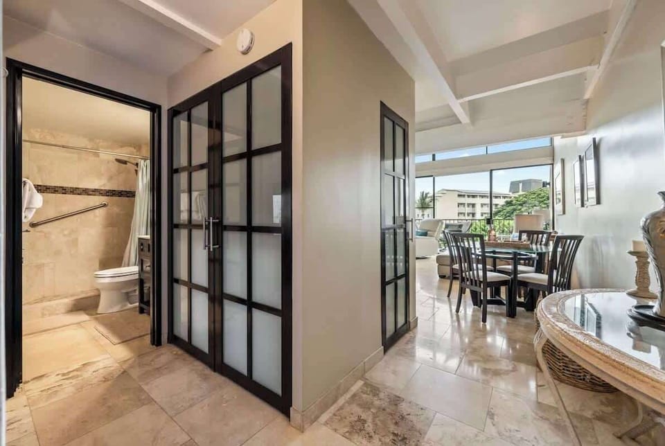 Bathroom is located downstairs off the entrance