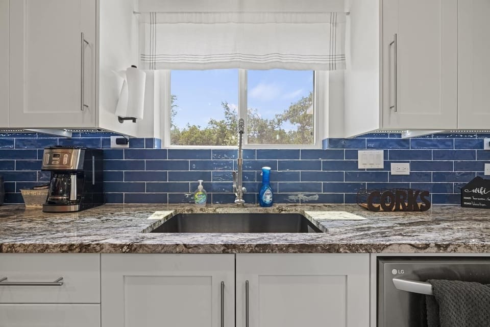 Bold blue tiles and a kitchen that means business.
