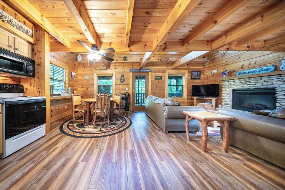 Enjoy a cozy fireplace, full kitchen, dining, and comfy sofas perfect for family gatherings.