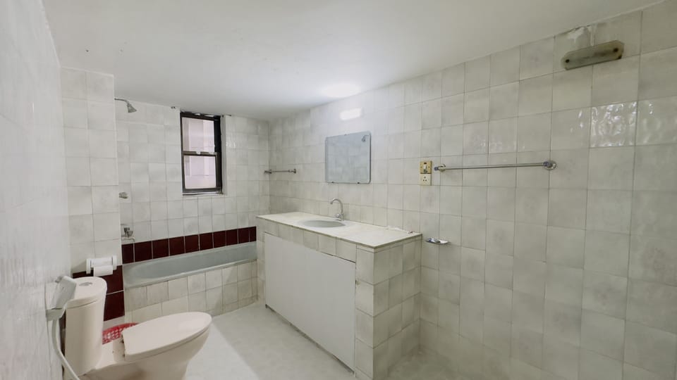 Shower, rainfall showerhead, slippers, towels