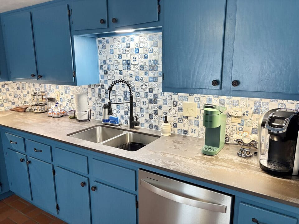 A full kitchen with stainless steel appliances