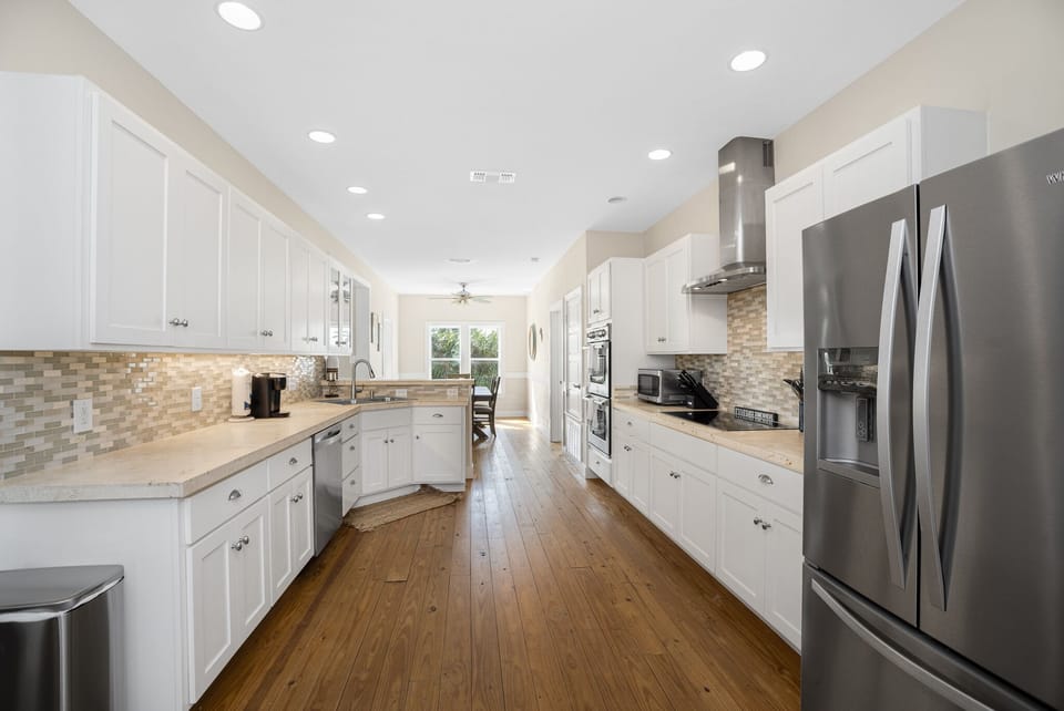 Gourmet Kitchen with Full Stock and countertop space! Includes coffee makers!