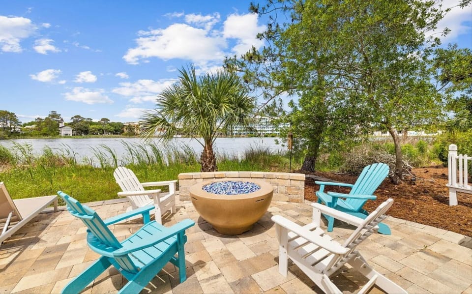 Gather around your private fire pit with lake views, where colorful Adirondack chairs invite cozy evenings under the stars.