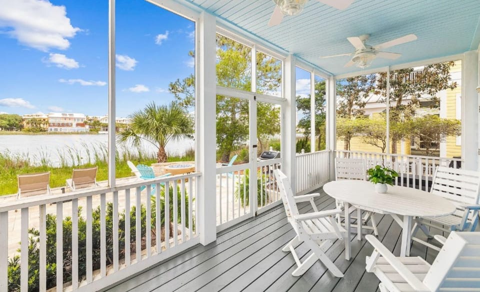 Relax on your private screened porch with waterfront views, perfect for morning coffee or evening meals.