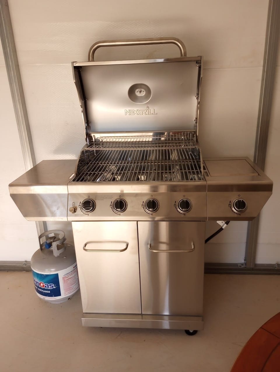 Propane grill located in mancave