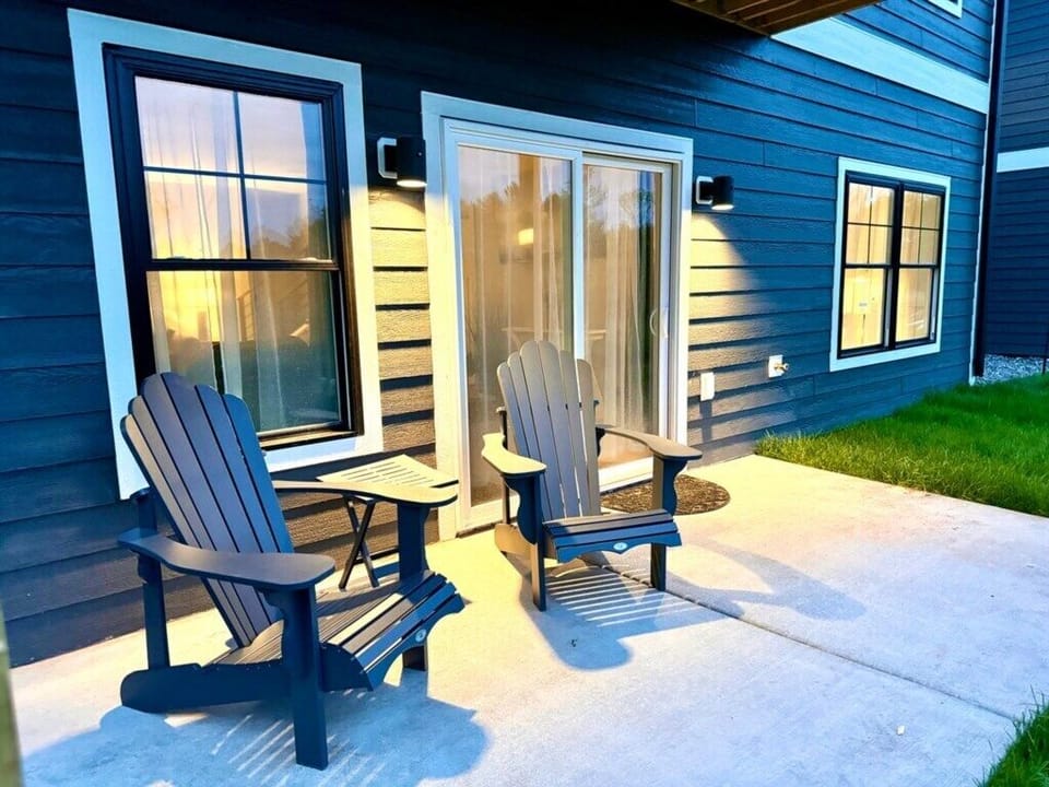 Relax in Adirondack chairs with stunning shoreline views at this Duluth North Shore rental.