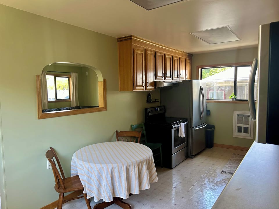 Eating area, along with stove & fridge