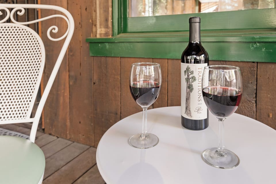 Enjoy a glass of wine on the front porch. 