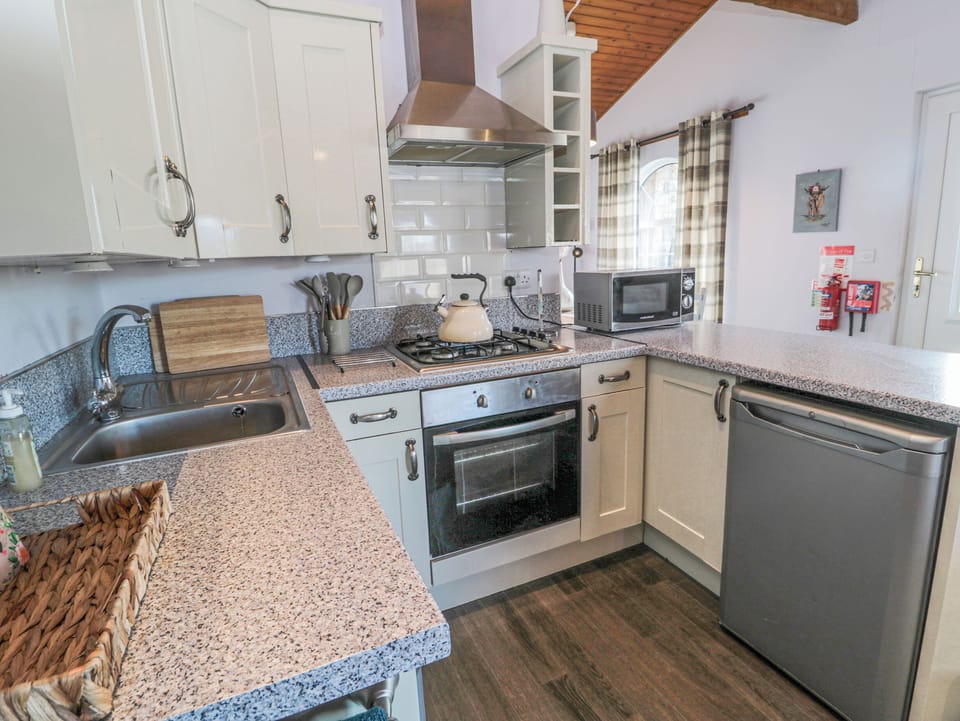 Fridge, electric kettle, toaster, cookware/dishes/utensils