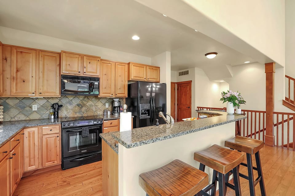  The open layout ensures everyone stays connected, whether you're cooking, dining, or lounging by the fire, making it ideal for gatherings and quality time