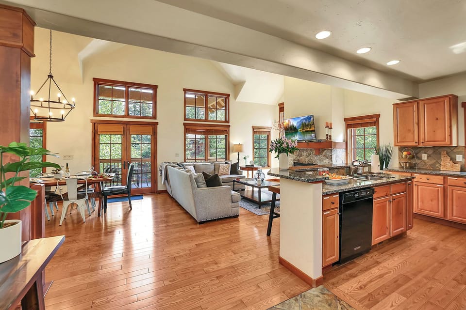 The open layout ensures everyone stays connected, whether you're cooking, dining, or lounging by the fire, making it ideal for gatherings and quality time