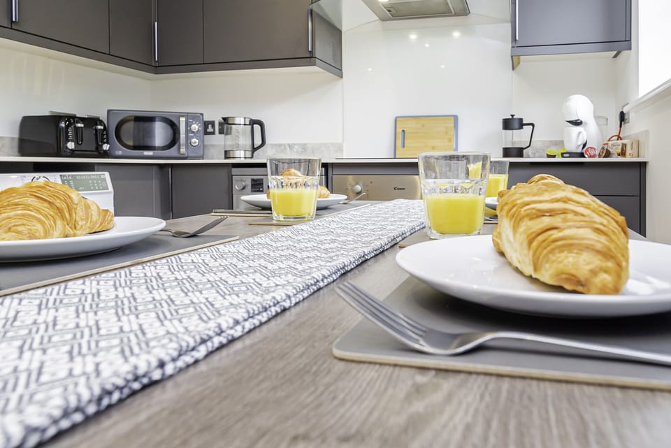 Stylish dining table, perfect for enjoying meals or gathering with friends and family in a warm, inviting space.