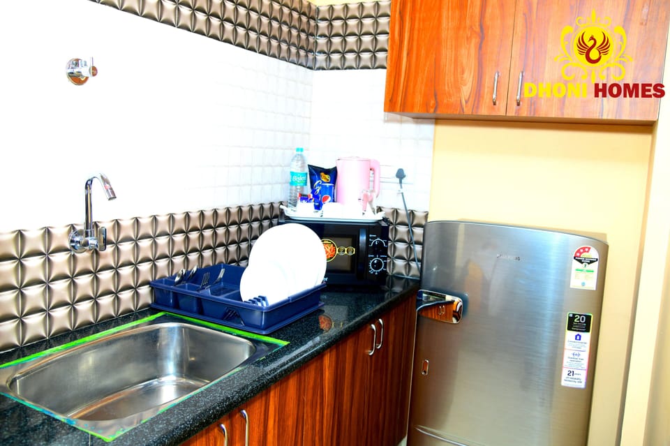 Full-size fridge, microwave, electric kettle, cleaning supplies
