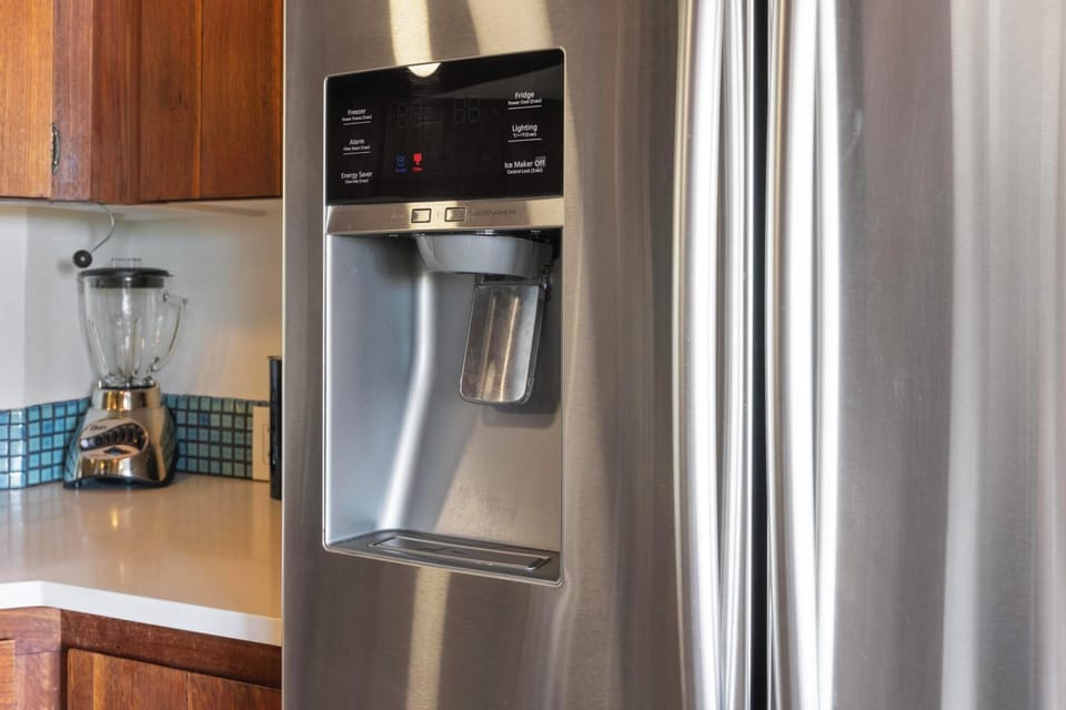 This kitchen features stainless steel appliances, making it easy to prepare meals in comfort during your stay in paradise.