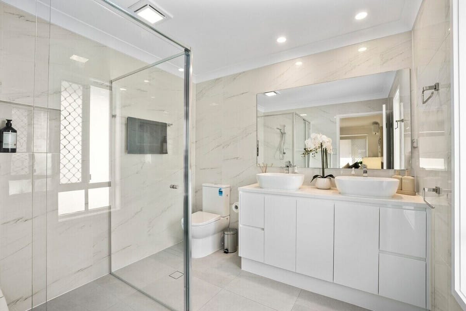 Full bathroom with walk in shower.