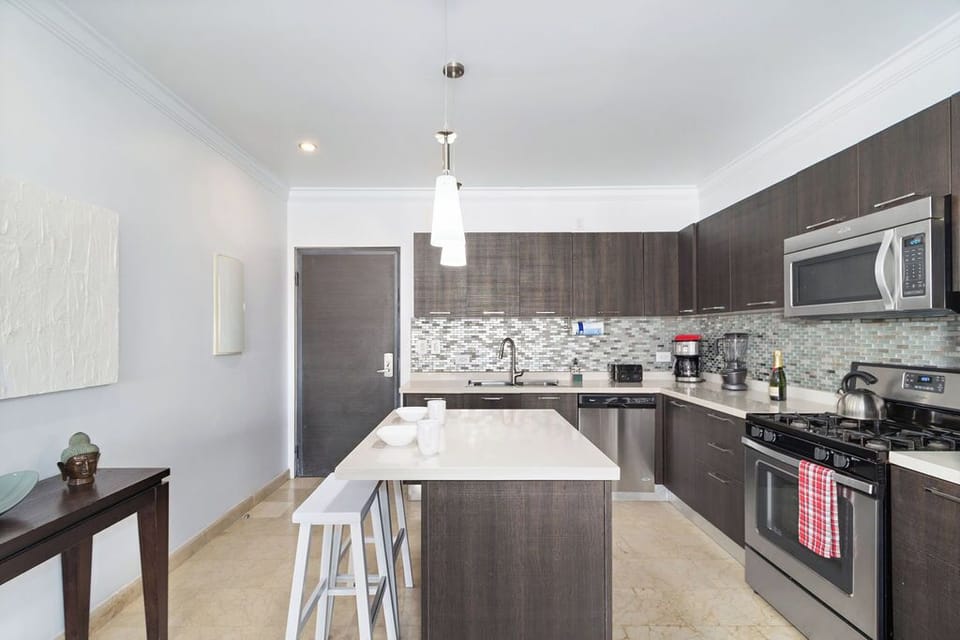 Sleek and stylish: Our modern kitchen and dining area are a feast for the eyes.