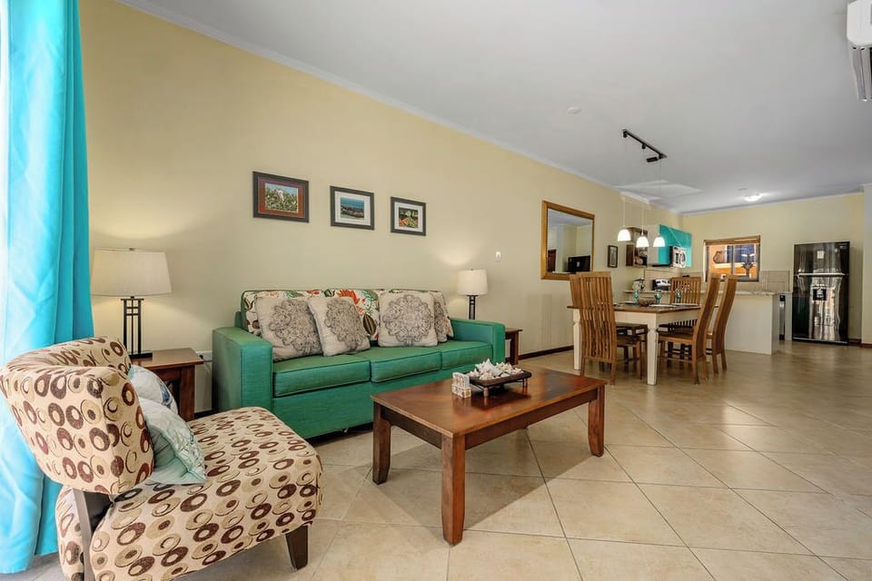 Cozy and bright living room with a  view to the outside thru a large sliding door.