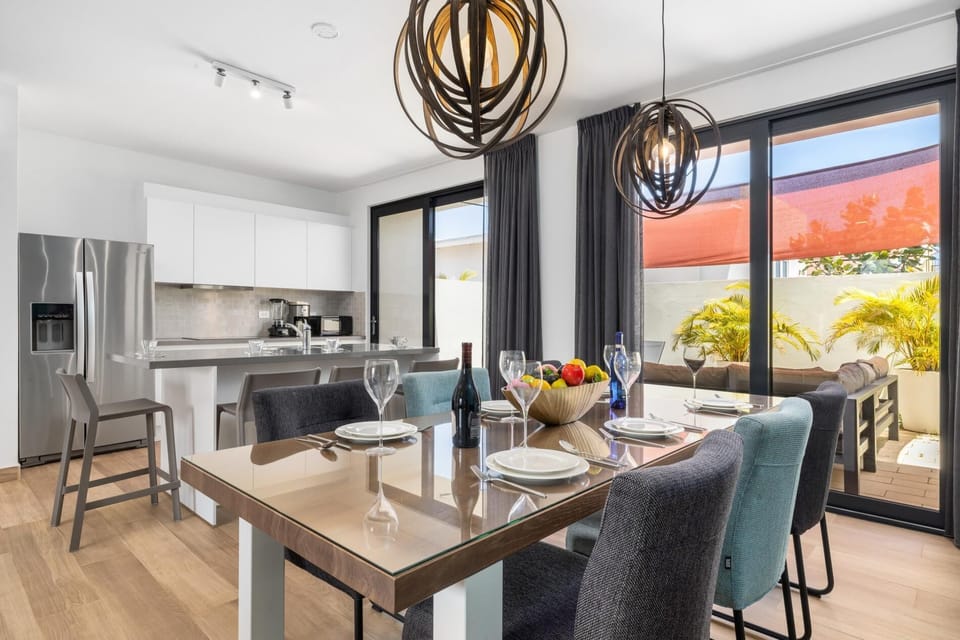 Modern and sleek. Prepare home-cooked meals in this stylish full kitchen and dining.