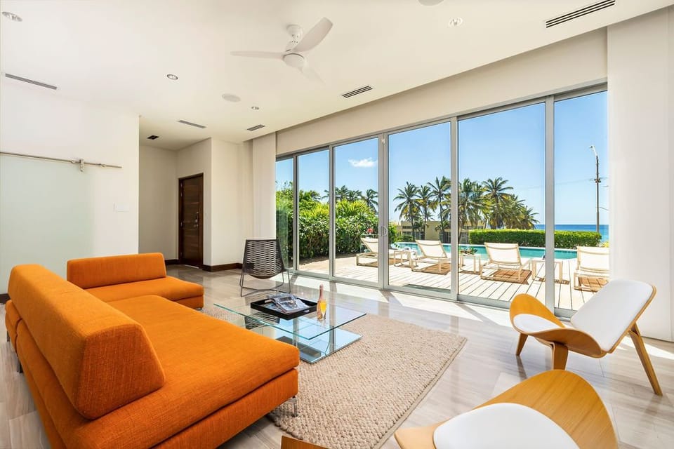 Step into the heart of the villa, where the open design seamlessly integrates the living room, dining space, and fully equipped kitchen.