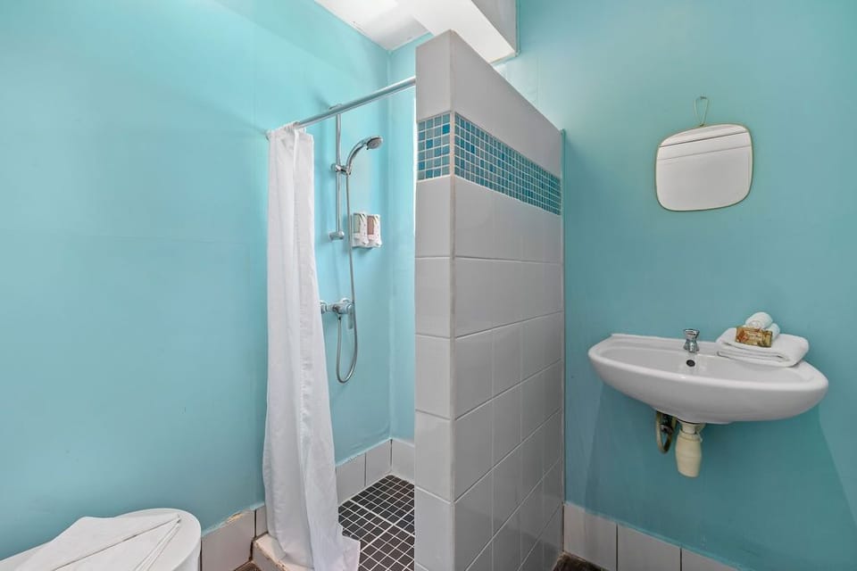 Pamper yourself in this chic bathroom with light blue and white tiles.