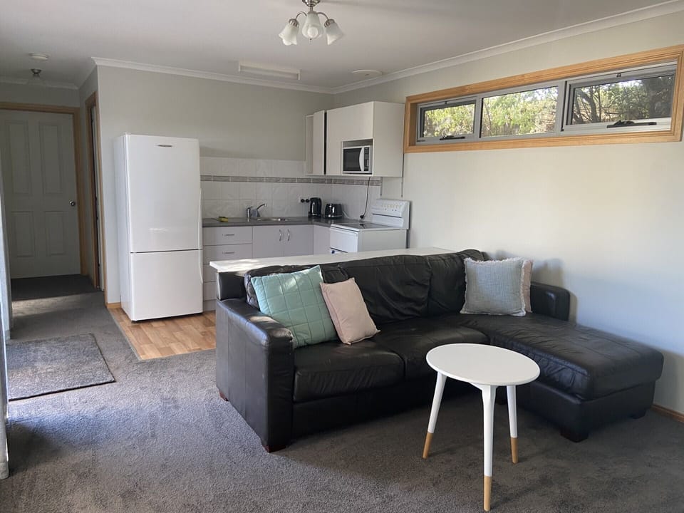 Small lounge with TV and kitchenette