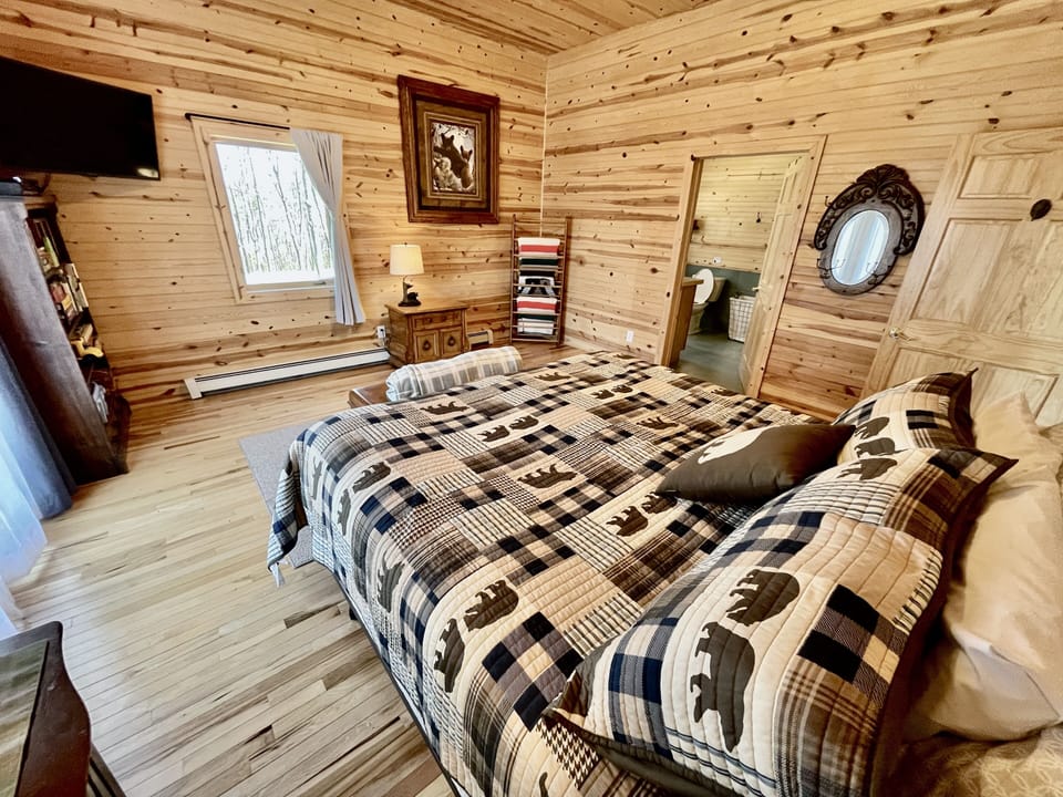 Master bedroom-king bed, TV, space for roll-away beds