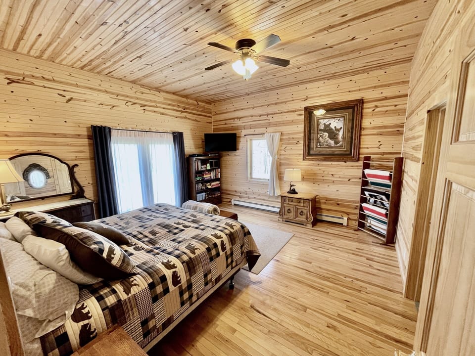 Master bedroom-king bed, TV, space for roll-away beds