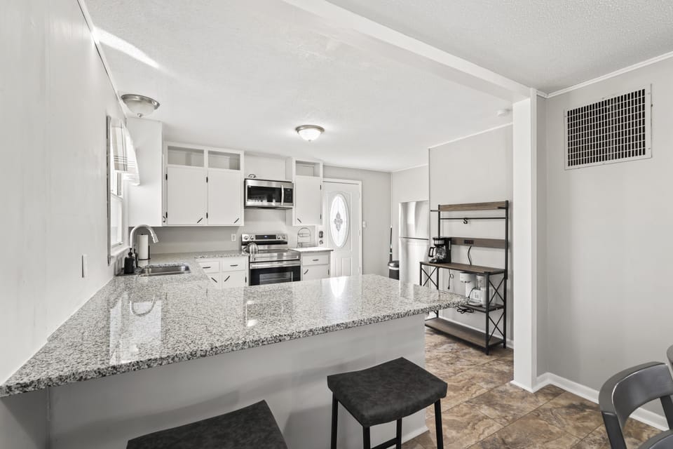 Granite countertop with 2 barstools
