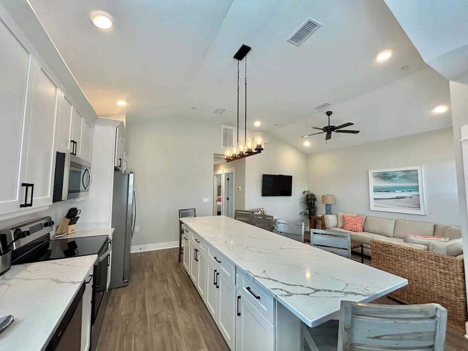 Spacious kitchen and living area designed for gathering.