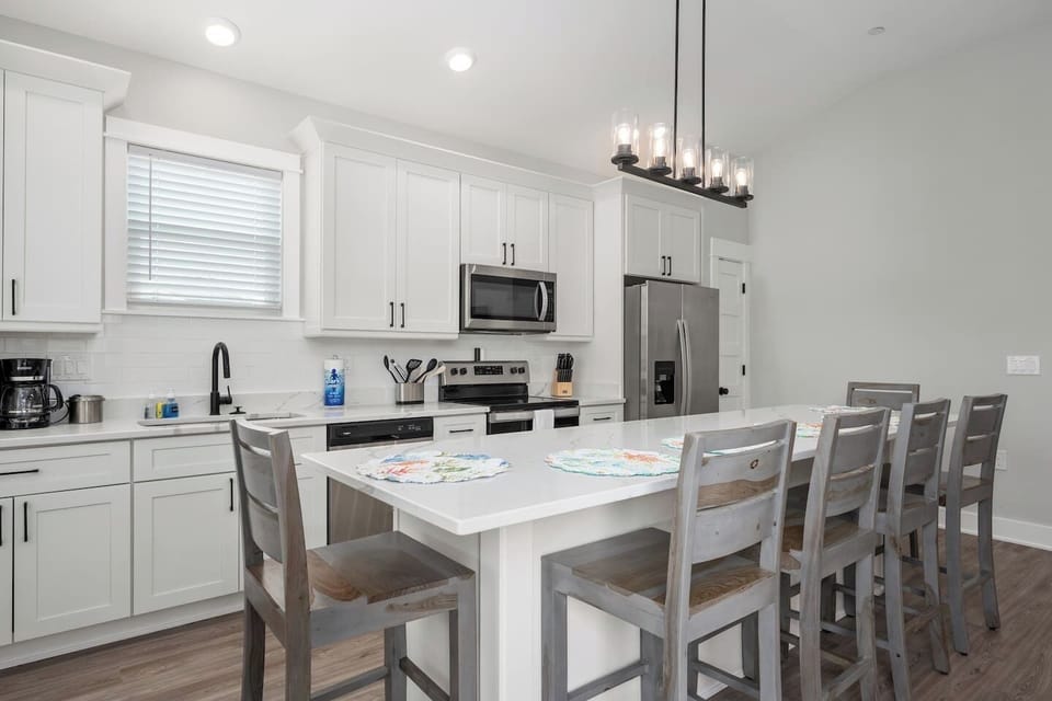 Fully equipped kitchen and dining area perfect for gathering.