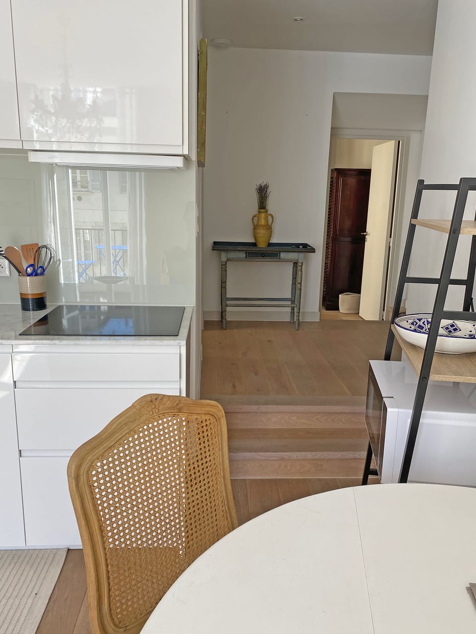 The living room/kitchen towards the hallway