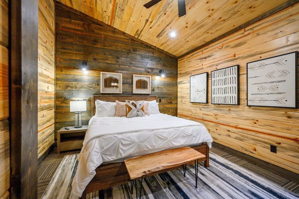 Fall asleep surrounded by wood, cowhide accents, and nature-inspired calm.