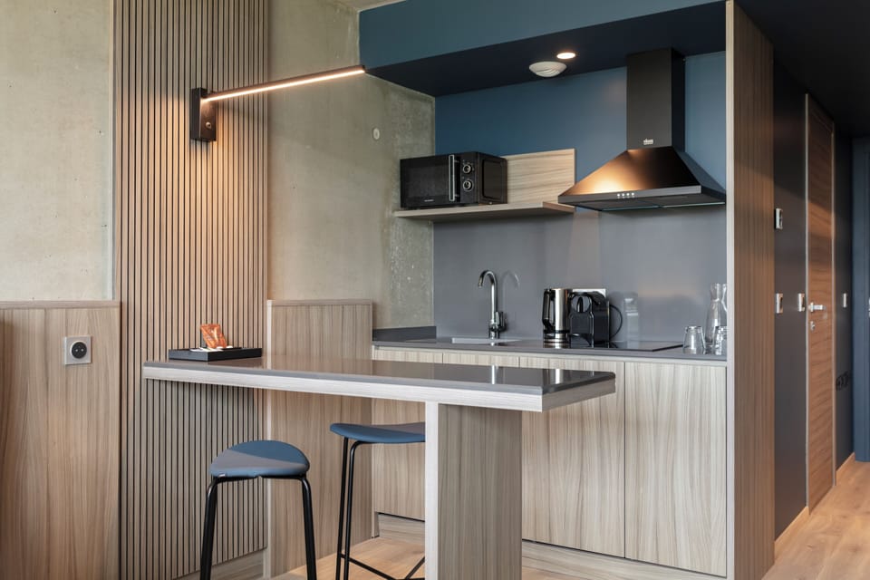 Premium Double or Twin Room, Pool Access | Living area | 55-inch flat-screen TV with satellite channels, books