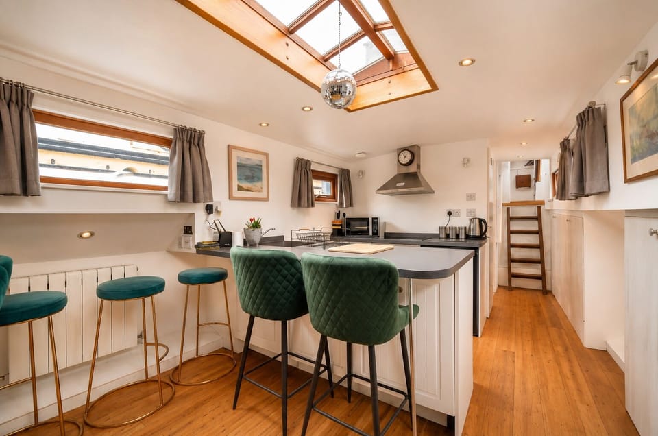 Compact galley with a breakfast bar, oven, stove, and all you need to cook