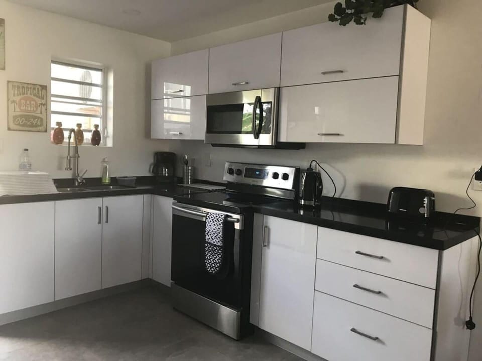 Villa | Private kitchen | Fridge, microwave, oven, stovetop