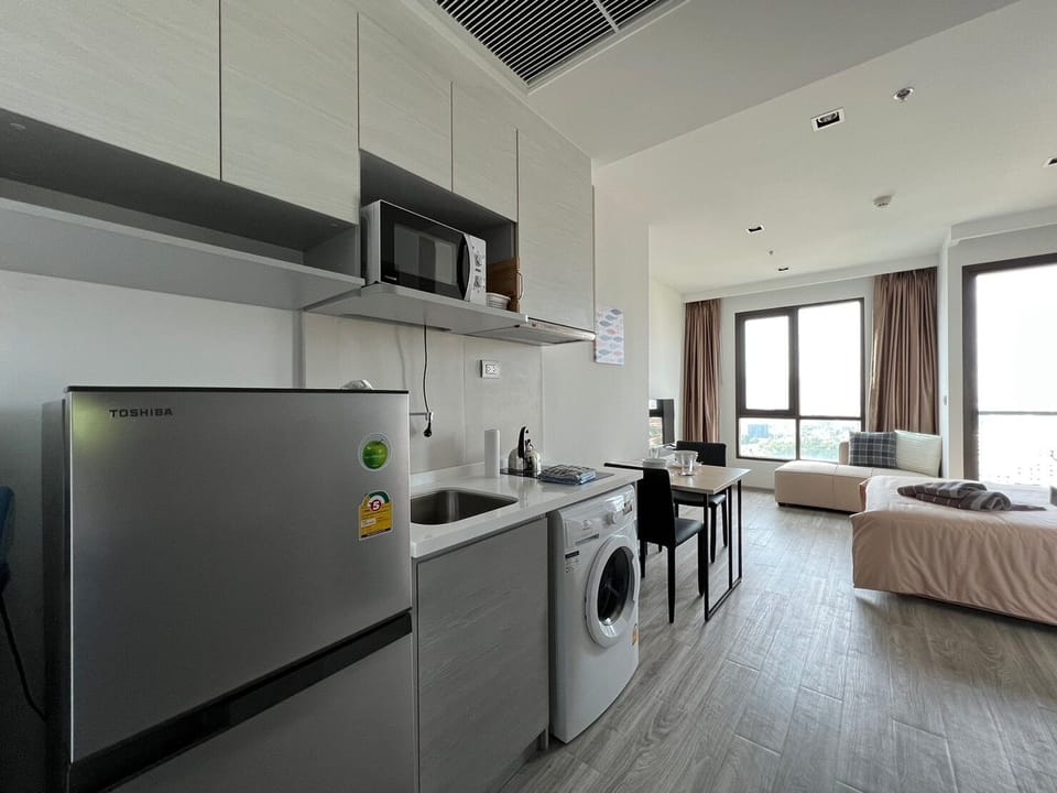 Premium Condo | Private kitchen | Full-size fridge, microwave, cookware/dishes/utensils
