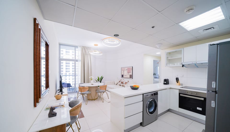 Deluxe Apartment | Living area | 55-inch Smart TV with cable channels