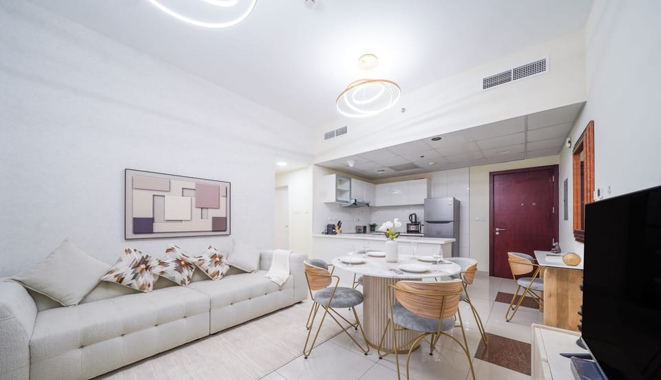 Deluxe Apartment | Living area | 55-inch Smart TV with cable channels
