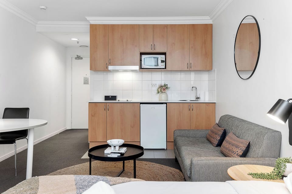 Make yourself at home in this cozy studio. The kitchenette is equipped with everything you need to prepare a quick meal, and the comfortable seating area is perfect for relaxing.