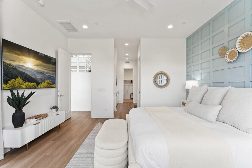 Calm bedroom retreat w/ soft tones, stylish accents & natural light.