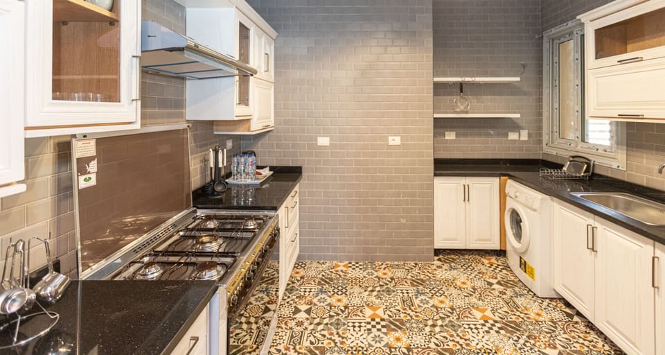 Standard Apartment, 2 Bedrooms | Private kitchen | Full-size fridge, microwave, electric kettle, cookware/dishes/utensils