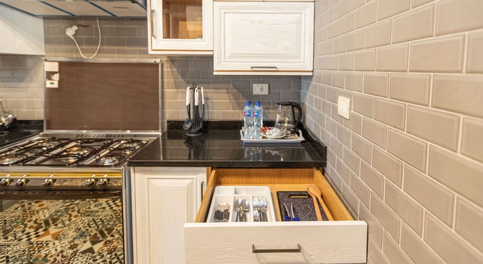 Standard Apartment, 2 Bedrooms | Private kitchen | Full-size fridge, microwave, electric kettle, cookware/dishes/utensils
