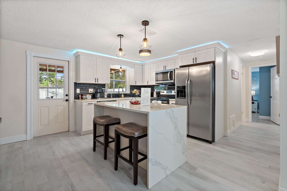 Beautiful remodeled kitchen with quart counter top & all the kitchen amenities.