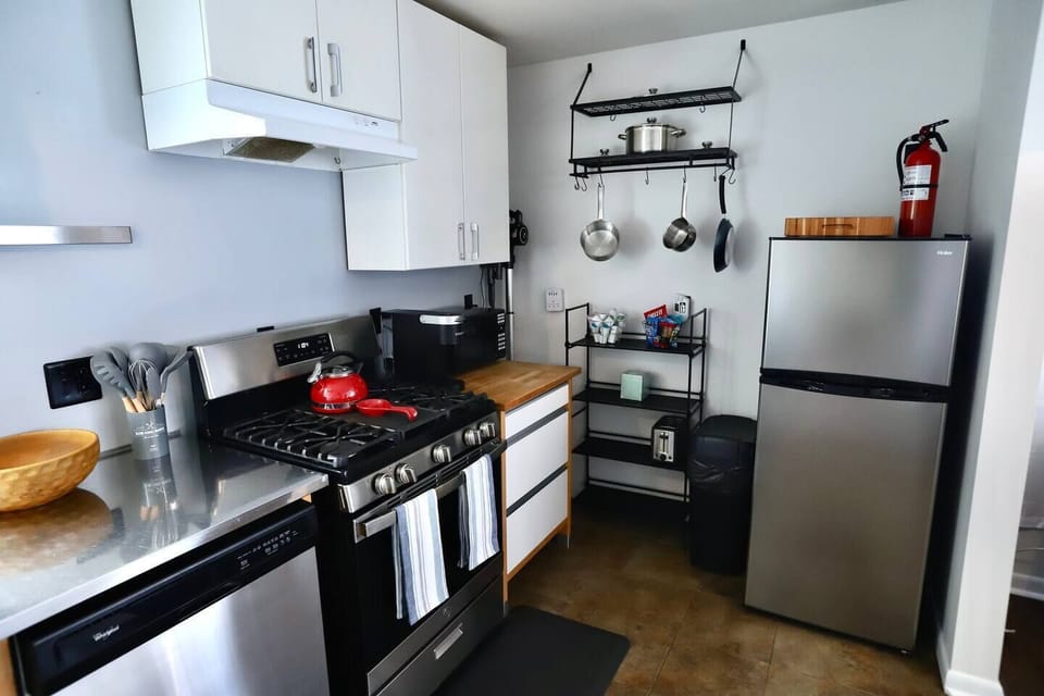Fully equipped kitchen with toaster, microwave, Keurig/pods, gas stove, oven, dishwasher, pots & pans, salt & pepper, oil/vinegar, spices