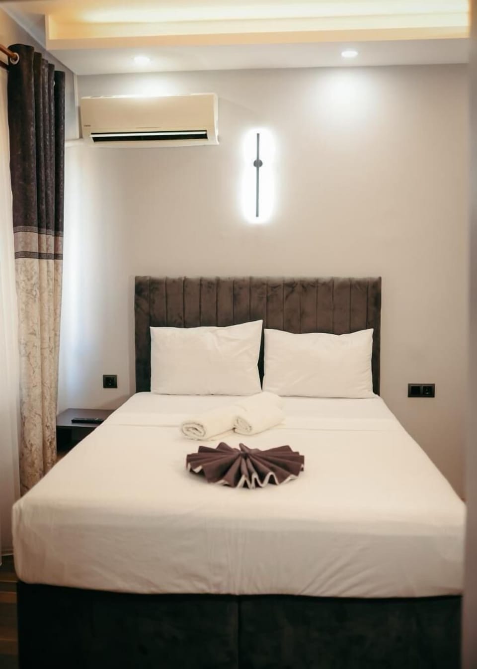 Desk, laptop workspace, bed sheets