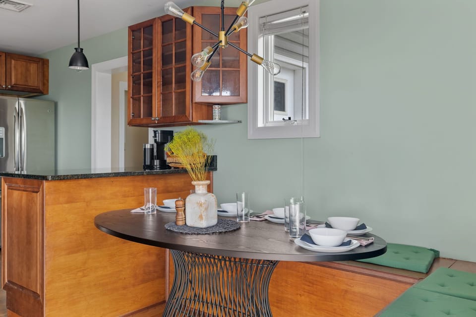 An inviting dining area with cozy banquet seating for five