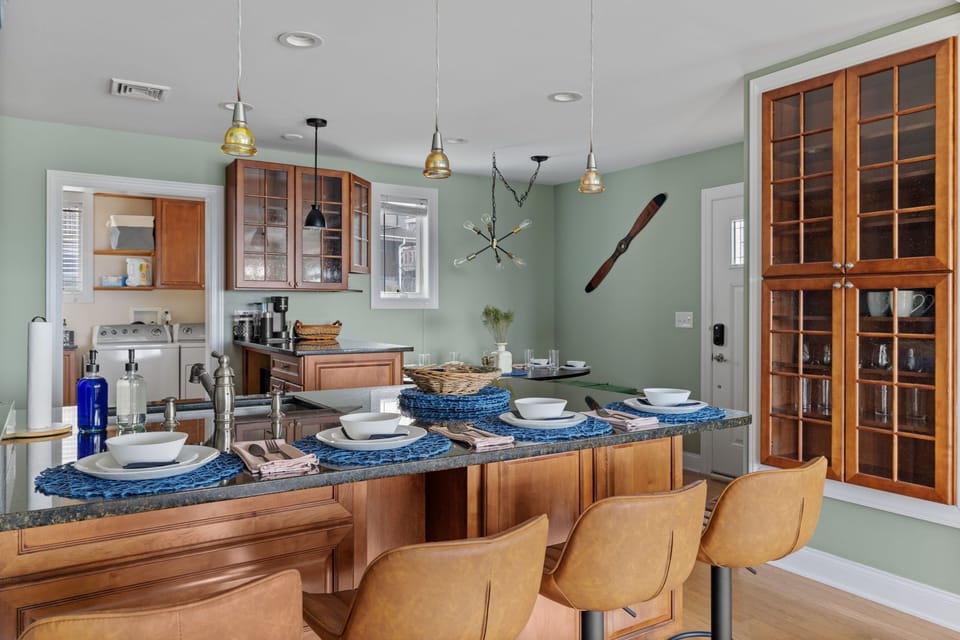 A contemporary kitchen bar with seating for four